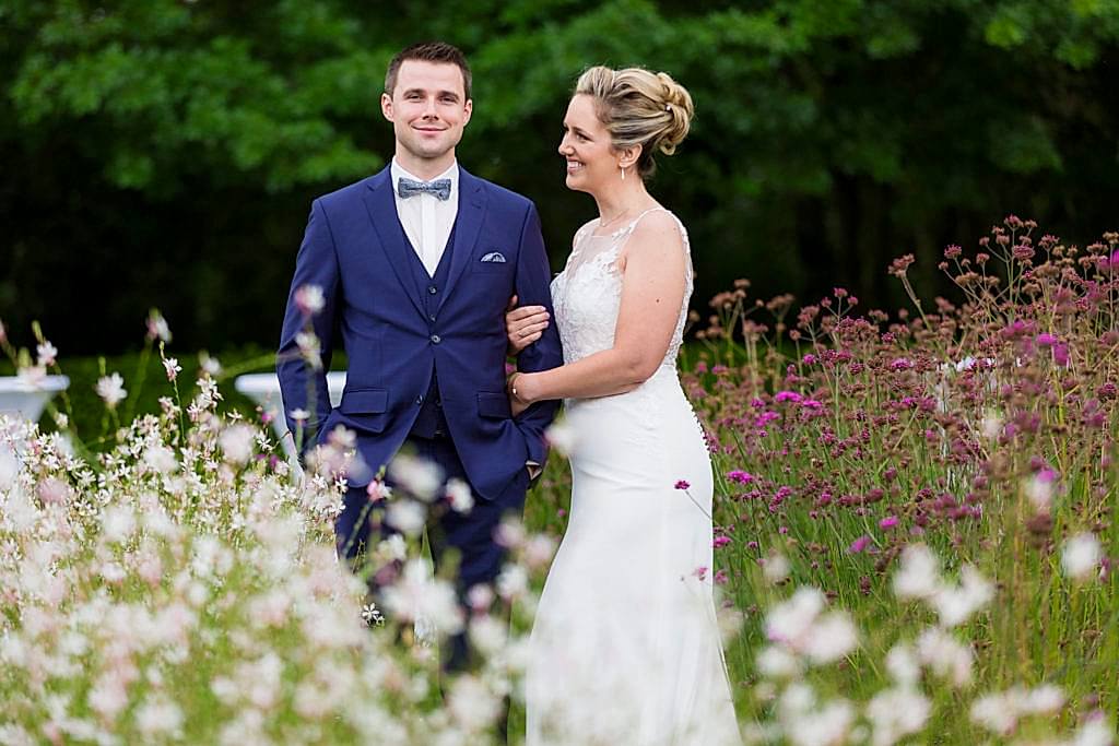 bride and groom in a flower field at Belgium garden wedding
