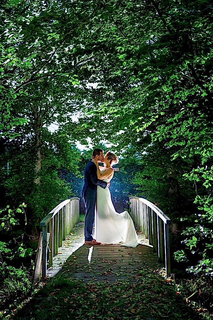 Wedding couple standing on bridge at Belgium Garden Wedding