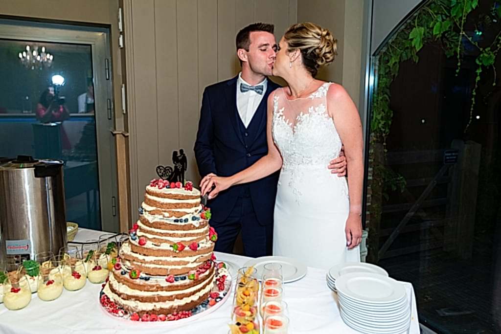 Cutting the cake at Belgium Garden Wedding