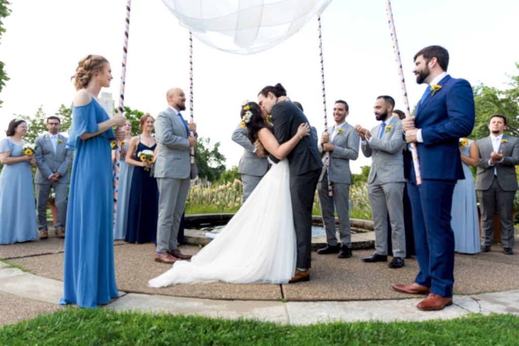 Phipps Conservatory Wedding groom kissing bride after ceremony