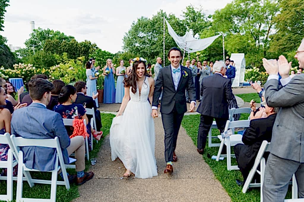 Bride and groom walking down the aisle after ceremony at Phipps Conservatory Wedding