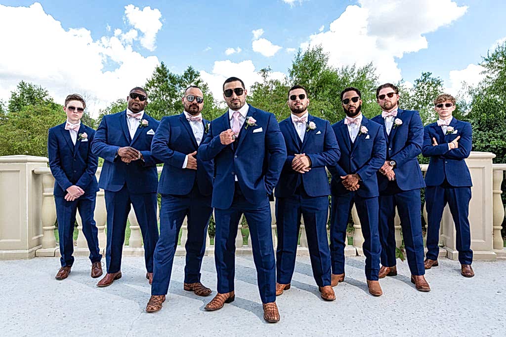 Groom and best men wearing black sunglasses