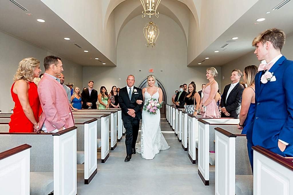 Elegant Montclair Venue Wedding bride walking down the aisle with her father