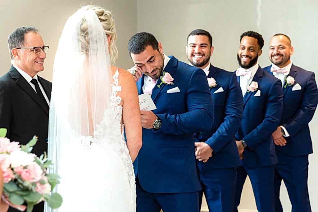 Groom crying during wedding ceremony