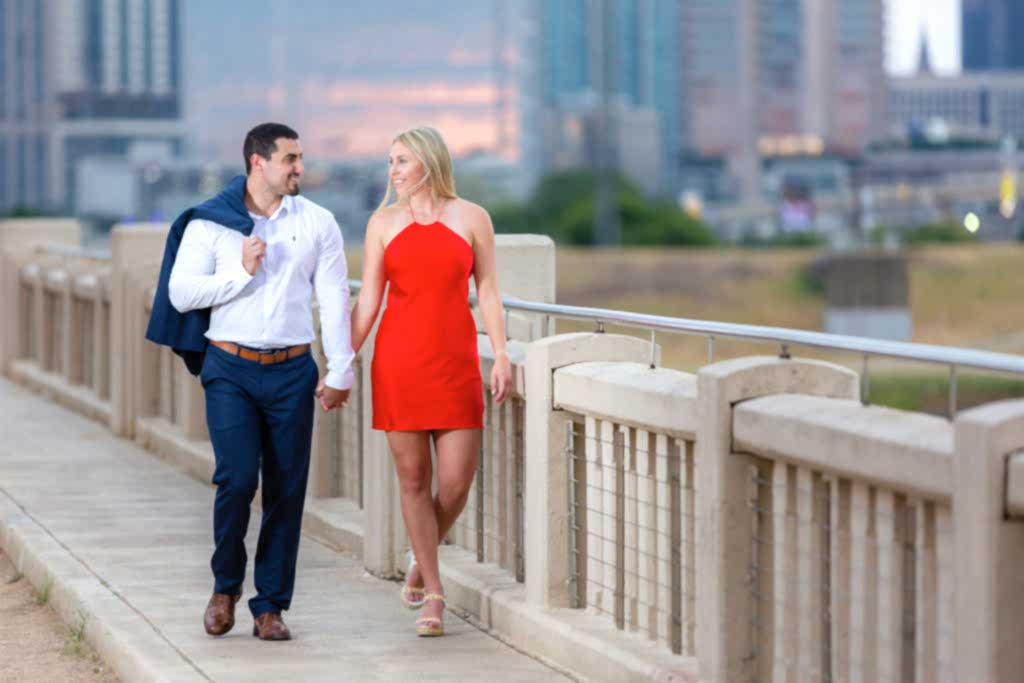 Couple walking hand in hand engagement session photos