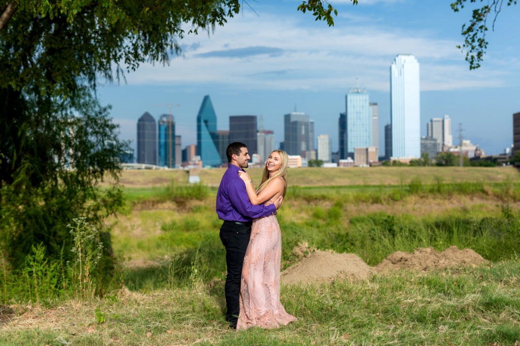 Happy couple with Dallas skyline in background