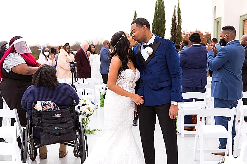 Bride and groom kissing after ceremony