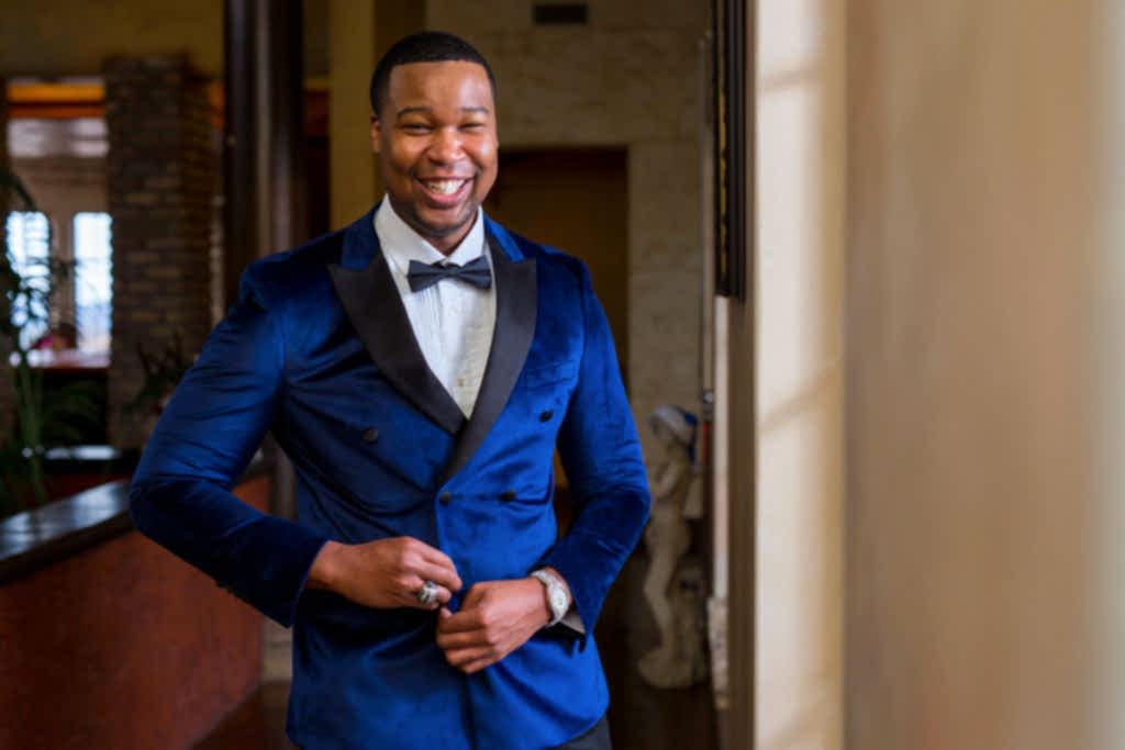 Groom in blue suit and bow tie