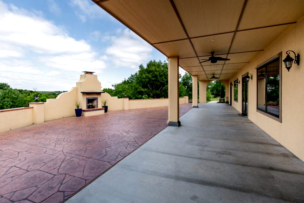 outdoor patio space with large fireplace for wedding cocktail hours or receptions