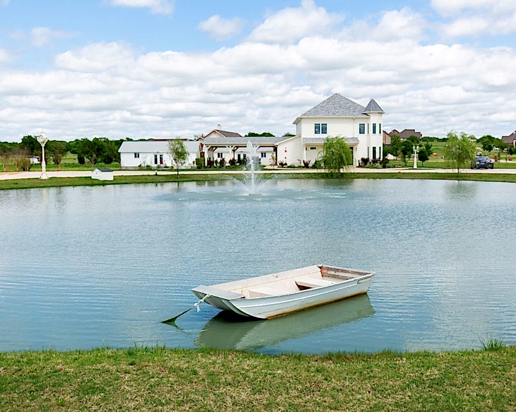 Pond with boat at One Preston