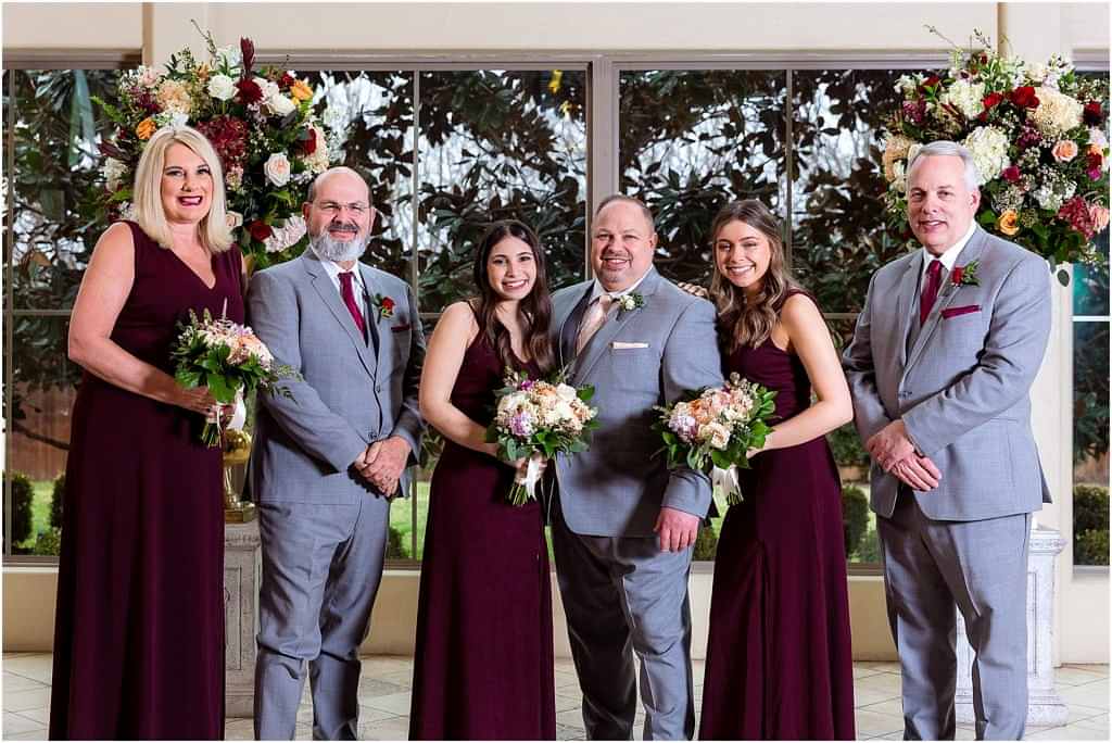 Close up photo of groom's family posing for Dallas wedding photographers