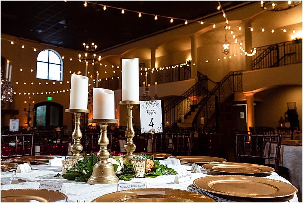 Table #4 set with white candles on gold pedestals photographed by Dallas wedding photographers