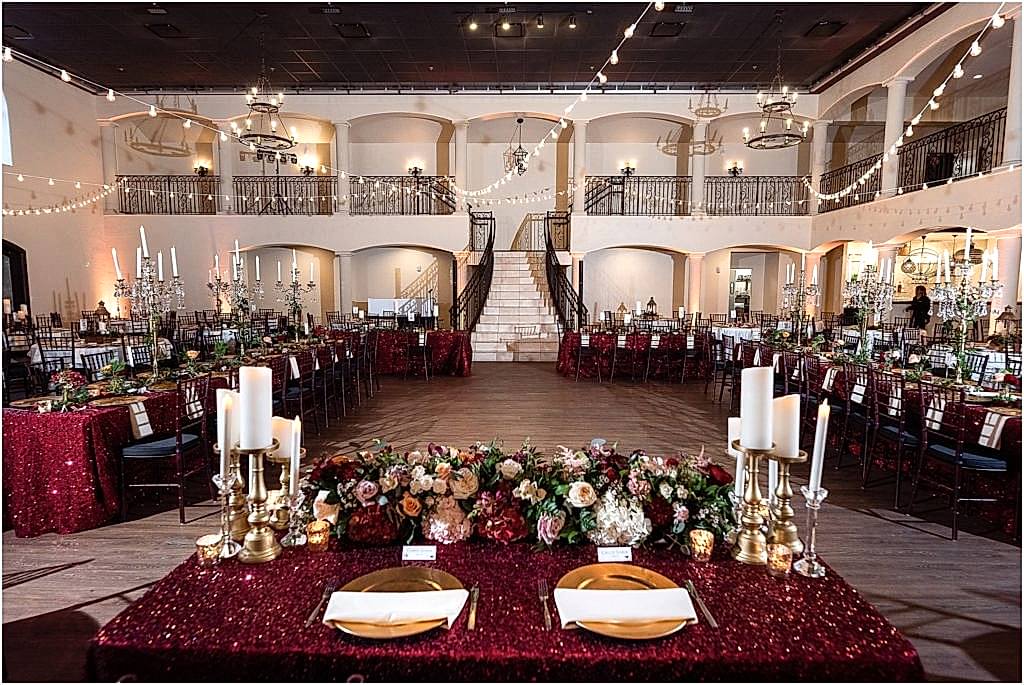 Grand staircase and decorated head table at ana villa grand ballroom in the colony texas
