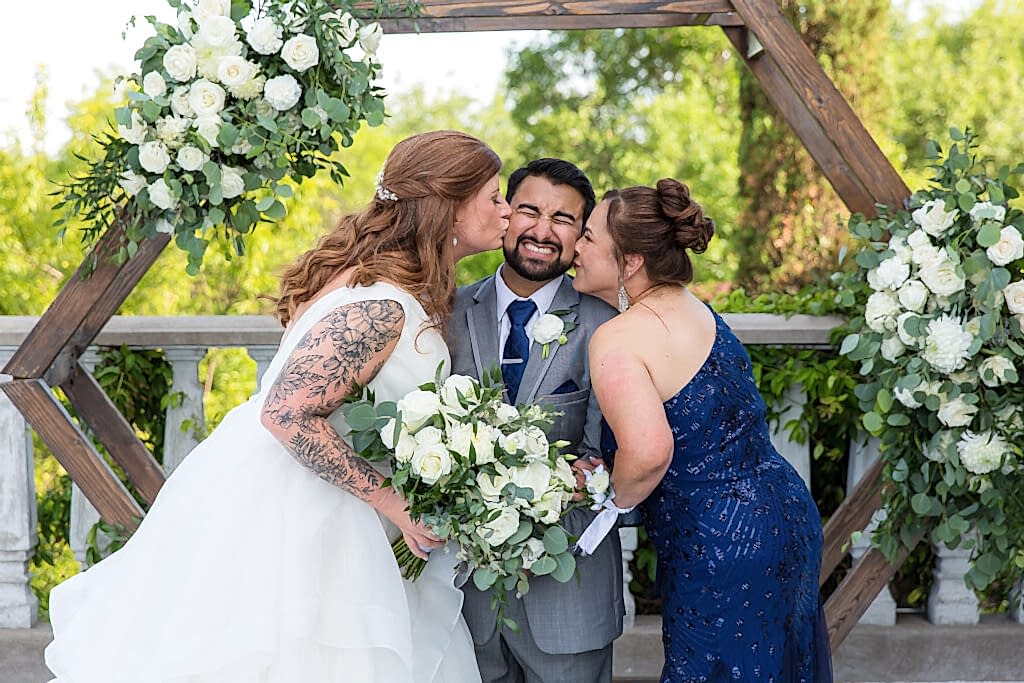 Mother and bride kissing groom's cheek during family formals after wedding ceremony at stoney ridge villa