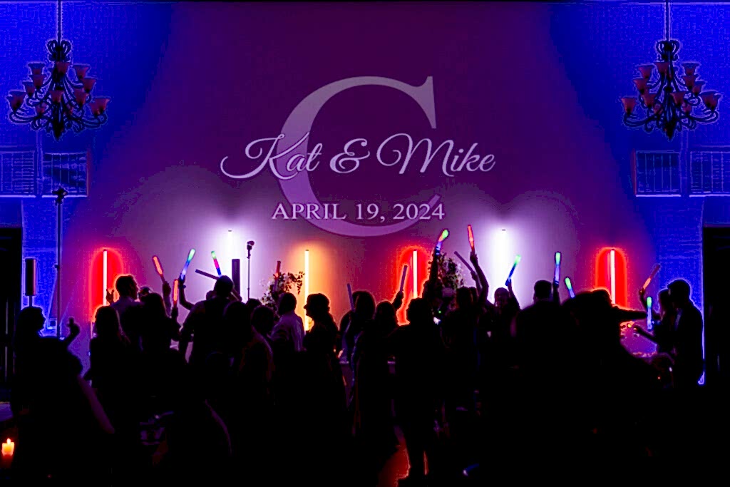 Azle TX wedding venue Stoney Ridge Villa reception colorful dance floor with silhouetted dancers