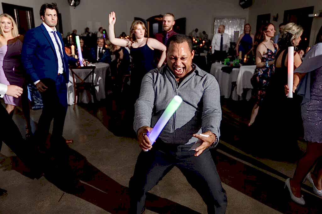 Man laughing on the dance floor during Azle wedding reception