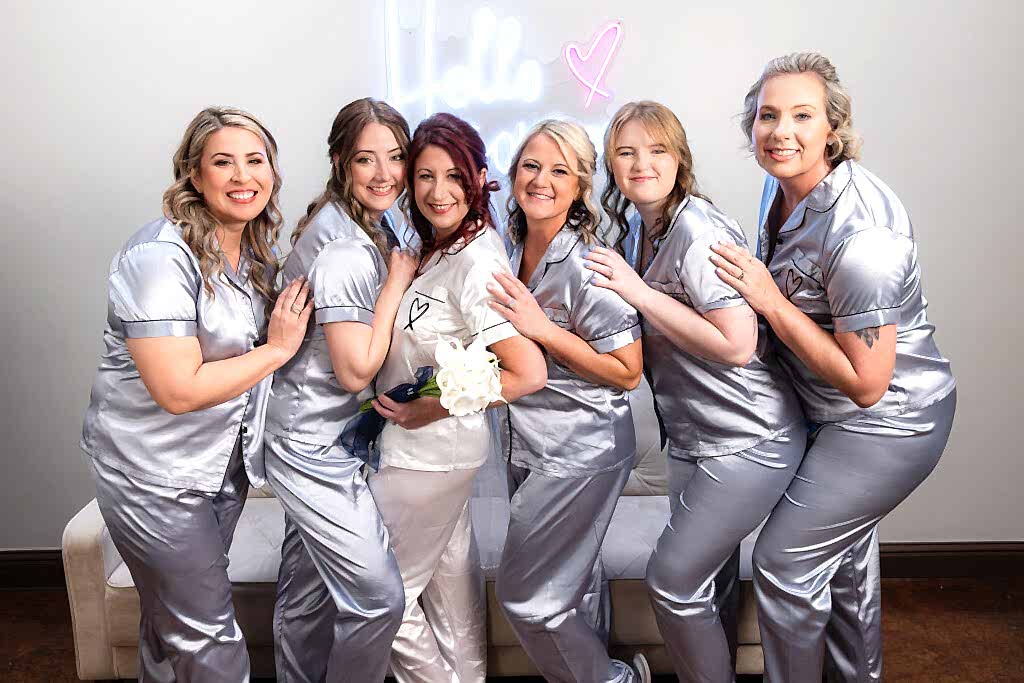Bride and bridesmaids in wedding pjs in Azle wedding venue bridal suite