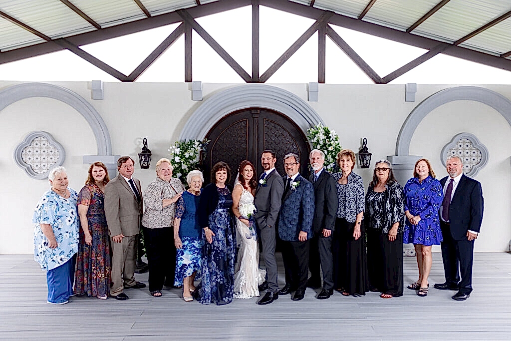 Large family photo with bride and groom at Azle TX ceremony space