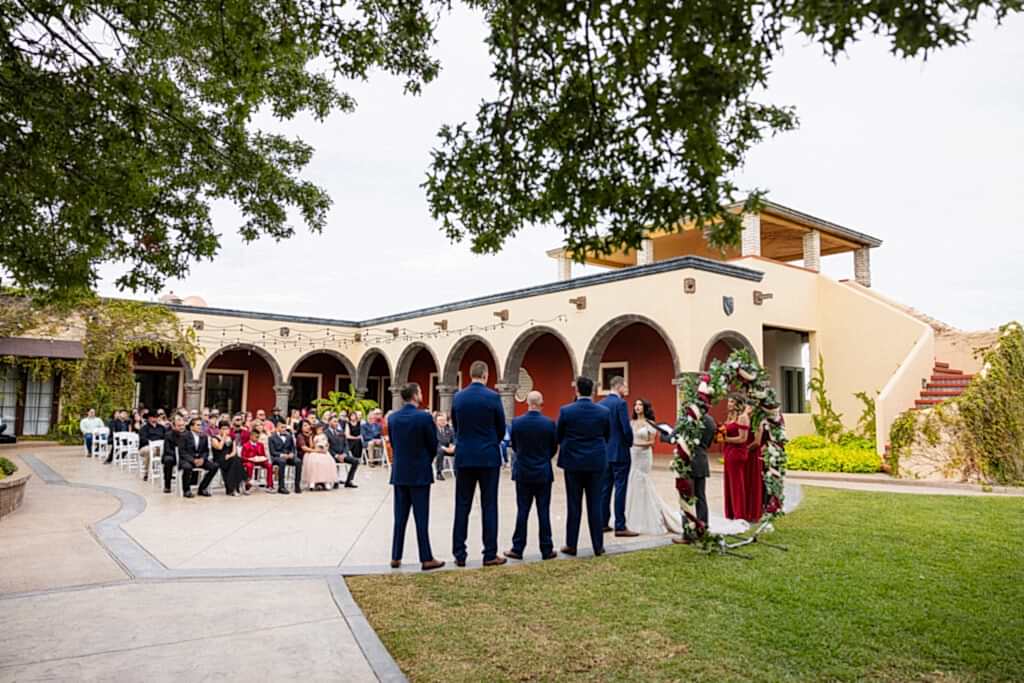 Wedding ceremony in courtyard at Fort Worth Estate Wedding venue