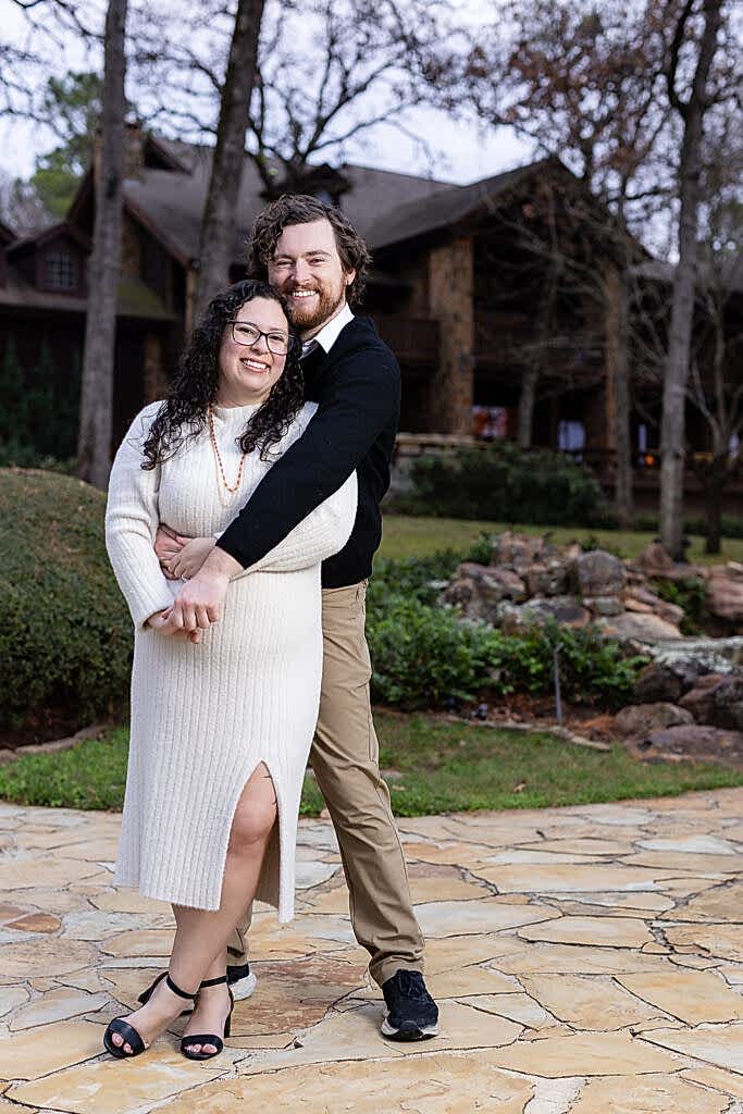 Engaged couple hugging and laughing during engagement session at their Mabank lakehouse in Texas