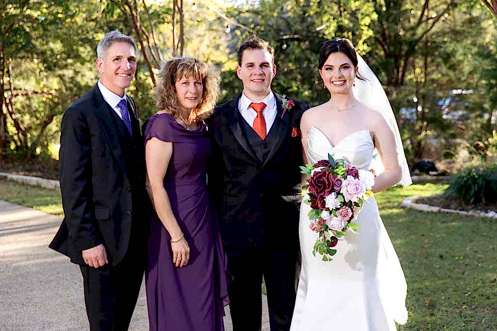 Family photo at Bella Woods wedding and event venue surrounded by trees